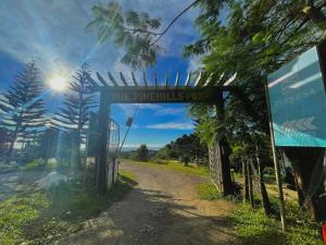 a gate at the entrance to the pineapples trail at The PineHill Farm in Tanay