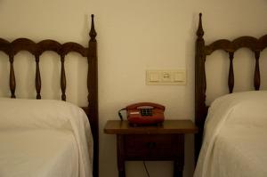 Postel nebo postele na pokoji v ubytování Hotel Álvarez