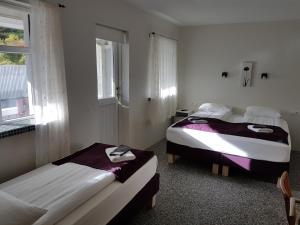 Voodi või voodid majutusasutuse The Vík Inn by Ourhotels toas