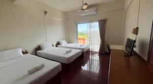 En eller flere senge i et værelse på Rawanda Resort Hotel