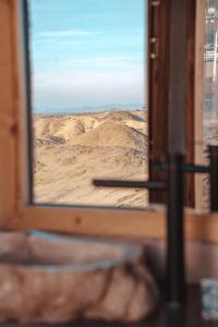 a view of the desert from a train window at SEVEN SAINTS Lodges in El Karia