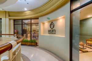a lobby of a store with a sign that reads horn at Hom Hostel & Cooking Club in Bangkok