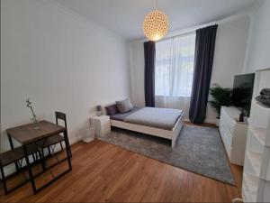 a living room with a bed and a table at Süße Marie 3 in Karlsruhe