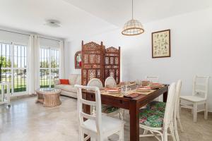a dining room with a table and chairs at Rincón del Sur in Vejer de la Frontera