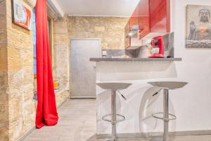 Kuchyň nebo kuchyňský kout v ubytování Studio Limogeanne centre historique, calme