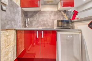 Kuchyň nebo kuchyňský kout v ubytování Studio Limogeanne centre historique, calme