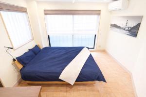 Postel nebo postele na pokoji v ubytování 金春in KONPAL