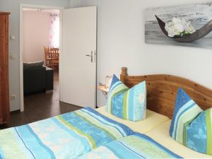 En eller flere senge i et værelse på Cosy Apartment in Weißig with Garden