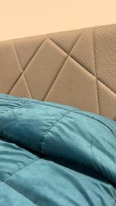 Giường trong phòng chung tại MARIO's HOUSE