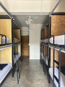 a group of bunk beds in a room at Sunnies 24 in Phra Ae beach