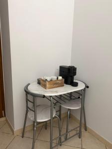 a small table with a box on top of it at Dimora Lanamar in Conversano