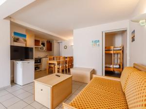 a living room with a couch and a kitchen at L Ocean N08 3P5 in La Tranche-sur-Mer +14 photos