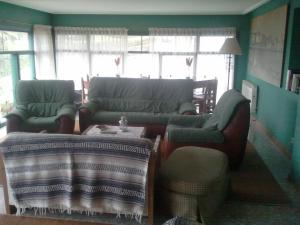 Zona de estar de Hotel Los Laureles