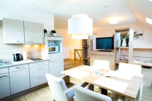 O bucătărie sau chicinetă la Hotel & Living Am Wartturm - Hotel & Apartments
