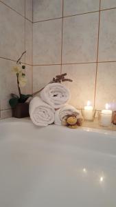 a group of towels and candles on a bathroom counter at Apartment Ana in Kali +49 photos