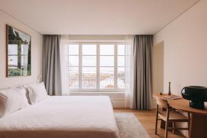 En eller flere senge i et værelse på Torel Lenscape