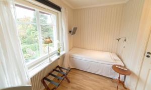 Postel nebo postele na pokoji v ubytování Hotell Stensborg