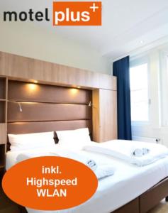 Postel nebo postele na pokoji v ubytování Motel Plus Berlin