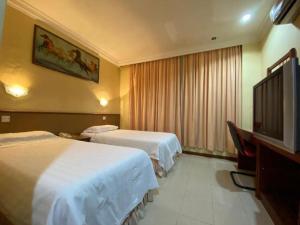 TV a/nebo společenská místnost v ubytování OYO 89958 Hotel Umimas