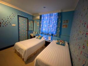 Postel nebo postele na pokoji v ubytování OYO 89958 Hotel Umimas