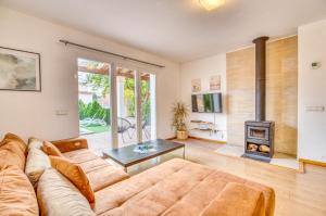 a living room with a couch and a fireplace at Ideal Property Mallorca - Villa Feel Good in Alcudia
