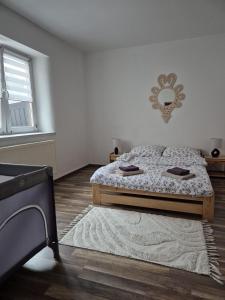 En eller flere senge i et værelse på Siedlisko Pod Babią Góra