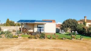 a house with solar panels on the roof at Palmaradise in El Palmar +18 photos