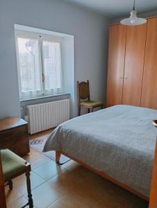 Postel nebo postele na pokoji v ubytování Casetta delle rose