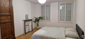 En eller flere senge i et værelse på Le Gîte des Travailleurs