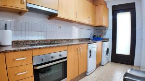 Køkken eller tekøkken på Apartalux San Pedro Playa