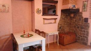 a kitchen with a table and a table and a stove at La Tavernetta in Ponte della Venturina