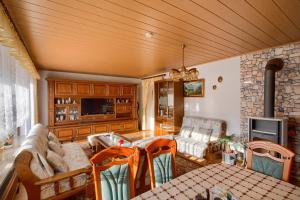 a living room with a couch and a table at Ferienwohnung in Lichtenfels mit 125 Quadratmeter in Lichtenfels