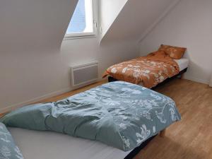 En eller flere senge i et værelse på Maison 400m de la mer