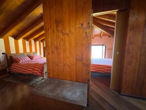 Giường trong phòng chung tại Casa Vacanza Castagna