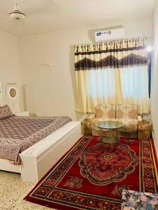 En eller flere senge i et værelse på Rehaish Plus Guest House + 6 billeder