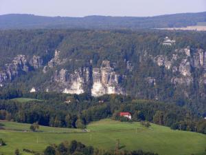 a house on a hill in front of a mountain at Villa Weißig in Struppen