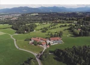 an aerial view of a house in a field at Schwaigerhof in Wackersberg