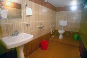 a bathroom with a sink and a toilet at Sheetal Homestay in Varanasi