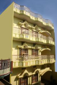 a building with balconies on the side of it at Sheetal Homestay in Varanasi