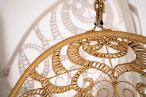 a chandelier hanging in front of a window at les doux secrets de Bergère in Périgueux