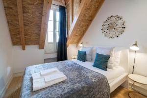 En eller flere senge i et værelse på Nomad's Augusta Collection - Classica