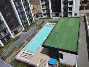 an overhead view of a swimming pool in an apartment building at Serenity Apartment Artesano in Nairobi