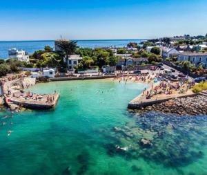 a group of people in the water at a beach at Two bed Seaside retreat in Dublin