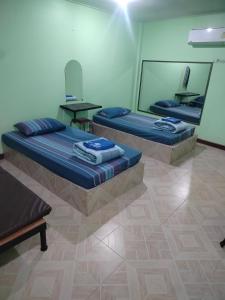 En eller flere senge i et værelse på Hongthong