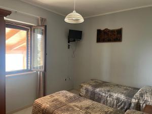 Giường trong phòng chung tại Agriturismo Castello