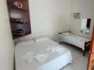 Giường trong phòng chung tại Pousada Iracema