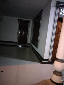 a room with a swimming pool in a building at Lankadays in Negombo