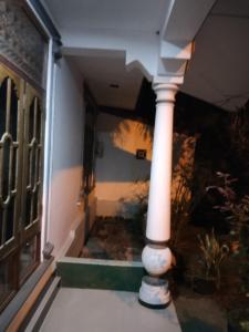 a column in a hallway of a house at Lankadays in Negombo