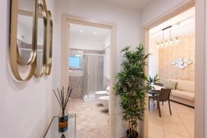 a bathroom with a toilet and a living room at Residence Perla in Misano Adriatico +50 photos