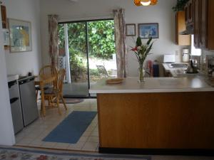 a kitchen with a counter and a dining room at Belle Vue Waimea B&B Corporation - Big Island of Hawaii in Waimea